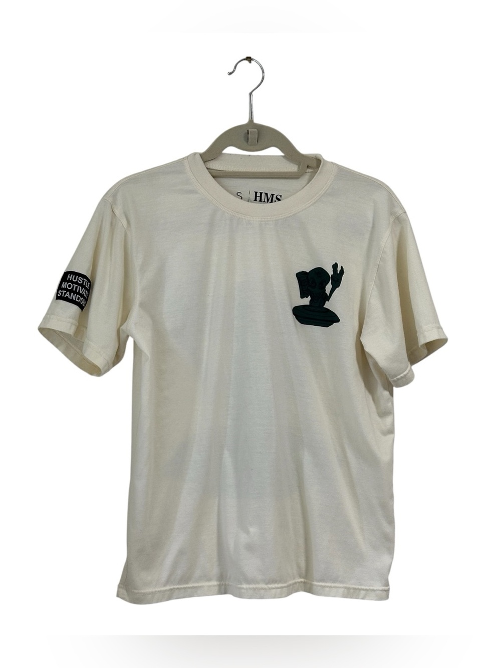 This unisex graphic tee in size small by HMS is a preowned beige T-shirt with a